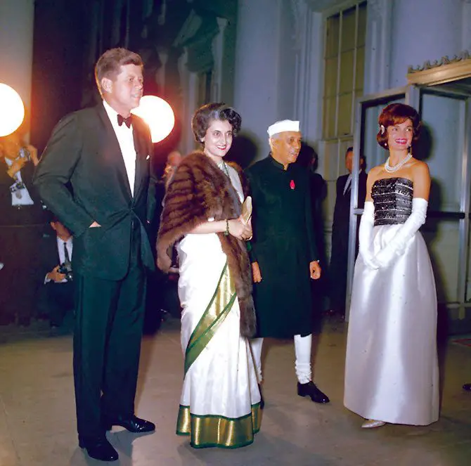 US President John F Kennedy and his wife Jacqueline with Jawaharlal Nehru and Indira Gandhi in Washington, DC, 1960.Indira often accompanied her father on official trips abroad. The sari-fur combination became her signature look.