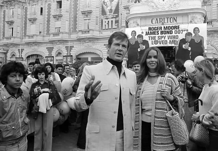 On May 20, 1977, Roger Moore accompanied by co-star Barbara Bach arrives for the screening of his latest 007 feature, 'The Spy Who Loved Me,' during the Cannes Film Festival at the French Riviera.